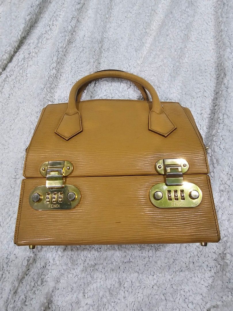 Vintage Fendi Vanity Bag (Category: Luxury Bags & Wallets) located in Tarlac. Submitted by attykrc (Listing ID 1303385628, Image 1). Description: Vintage Fendi Vanity Bag in Epi Leather Very unique bag. Lower part is vanity case with mirror and with code lock (you can store important items). Handbag but you can attach the strap to make it as shoulder bag. Guaranteed authentic..