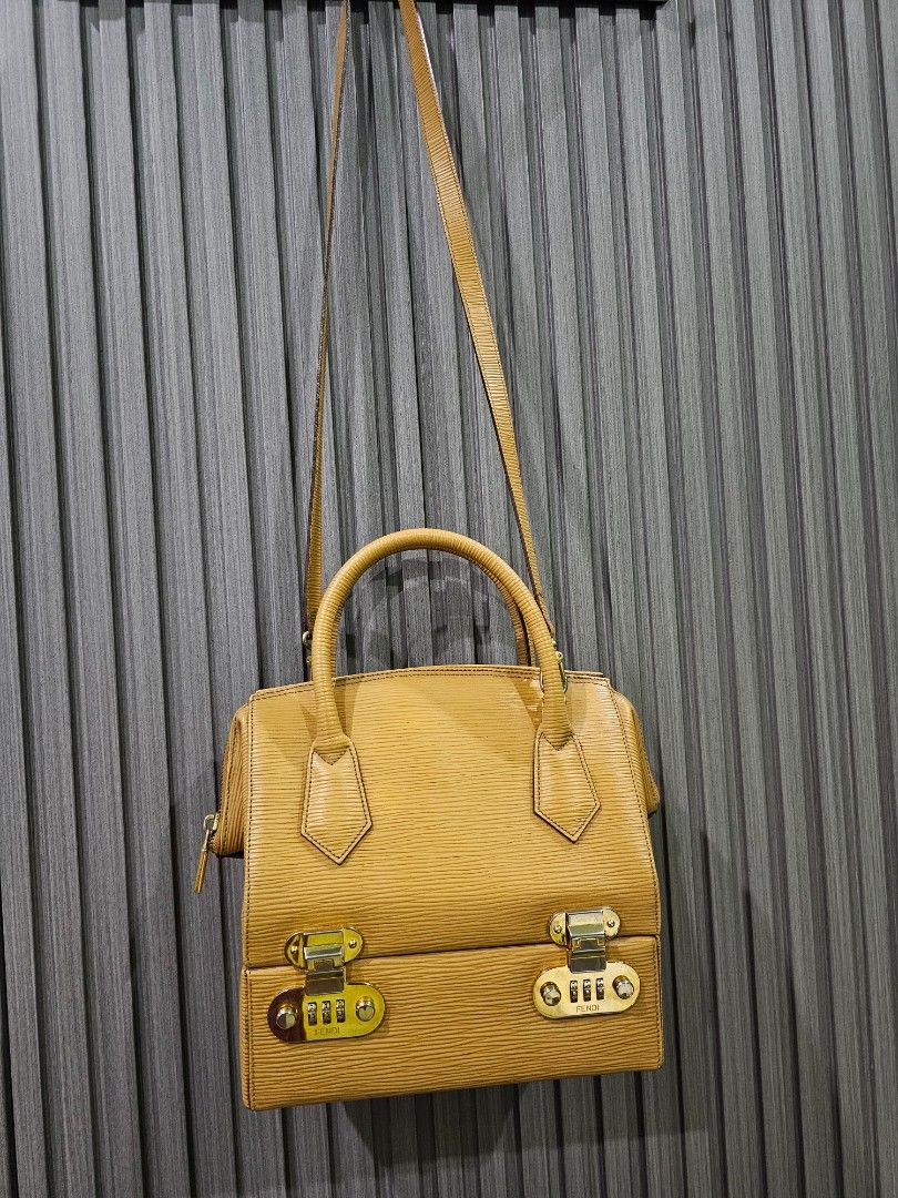 Vintage Fendi Vanity Bag (Category: Luxury Bags & Wallets) located in Tarlac. Submitted by attykrc (Listing ID 1303385628, Image 2). Description: Vintage Fendi Vanity Bag in Epi Leather Very unique bag. Lower part is vanity case with mirror and with code lock (you can store important items). Handbag but you can attach the strap to make it as shoulder bag. Guaranteed authentic..