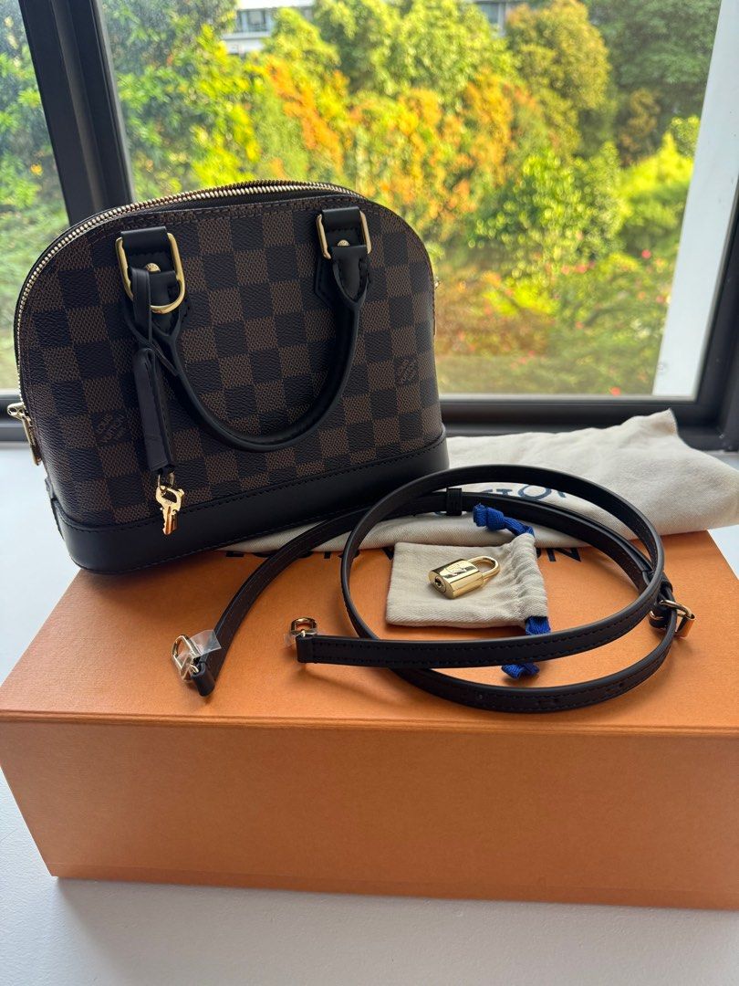Louis Vuitton Alma BB (Category: Bags & Wallets) located in Singapore. Submitted by clarecloe (Listing ID 1299207653, Image 2). Description: It’s in excellent condition, well-maintained with an organizer, has no defects. Bought from Spain LV shop in May 2024 Comes with original receipt, dust bag, box and paper bag Details: 23.5 x 17.5 x 11.5 cm (Length x Height x Width) Damier Ebene coated canvas Smooth cowhide-leather trim Textile lining Gold-co