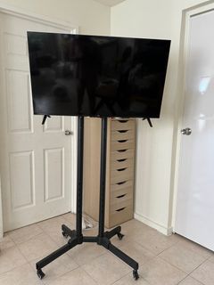 TV STAND WITH WHEELS (TV not included)