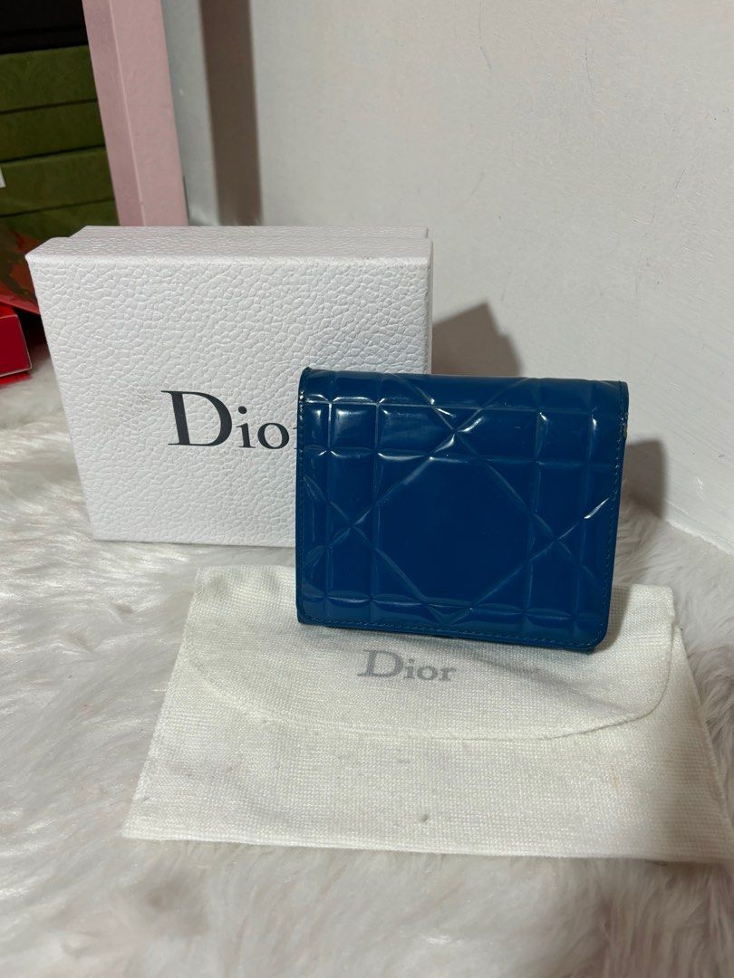 Dior Trifold Compact Patent Short Wallet (Category: Luxury Bags & Wallets) located in Quezon City. Submitted by box.luxebycheng (Listing ID 1303742960, Image 1). Description: Comes with box, paperbag and dustbag Has minor signs of usage but still presentable Missing Dior Charm.
