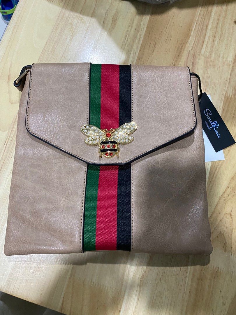 Khaki Unisex Sling bag (Category: Cross-body Bags) located in Caloocan City. Submitted by bagsyunlimited (Listing ID 1303599311, Image 2). Description: 📌 Unisex Shoulder/Sling bag 📌 Colors may vary. 📌 Excess items from Bazaar. 📍 South Caloocan .
