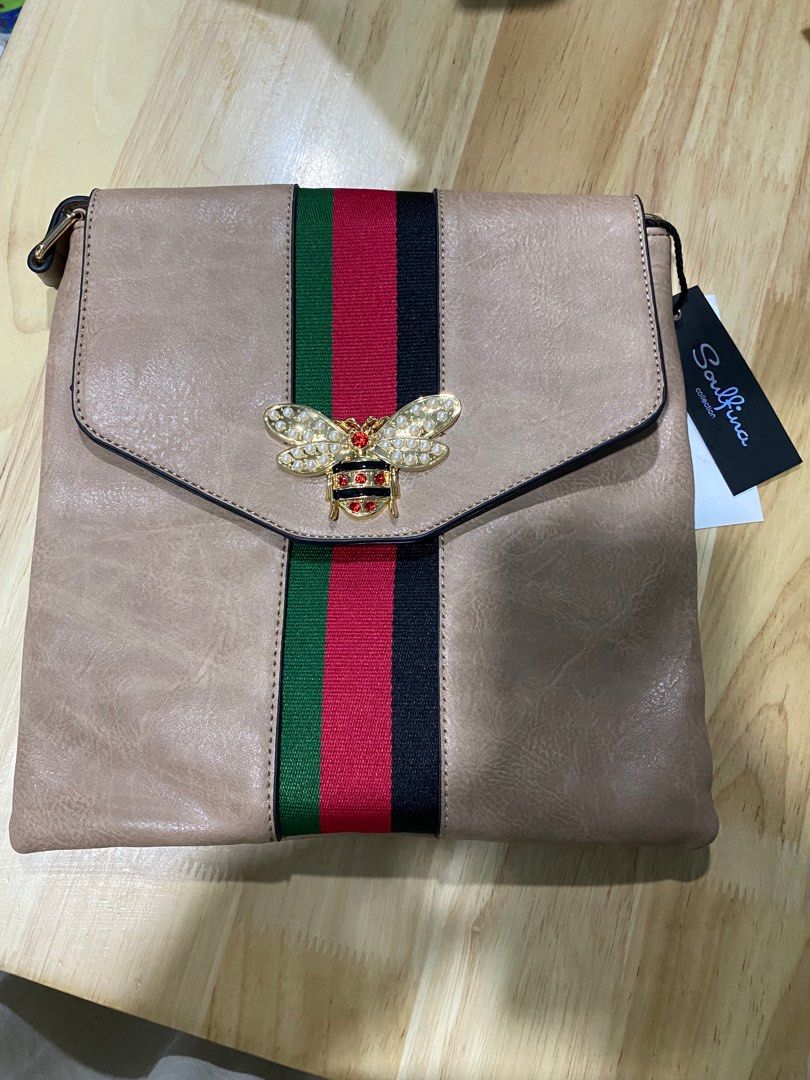 Khaki Unisex Sling bag (Category: Cross-body Bags) located in Caloocan City. Submitted by bagsyunlimited (Listing ID 1303599311, Image 3). Description: 📌 Unisex Shoulder/Sling bag 📌 Colors may vary. 📌 Excess items from Bazaar. 📍 South Caloocan .