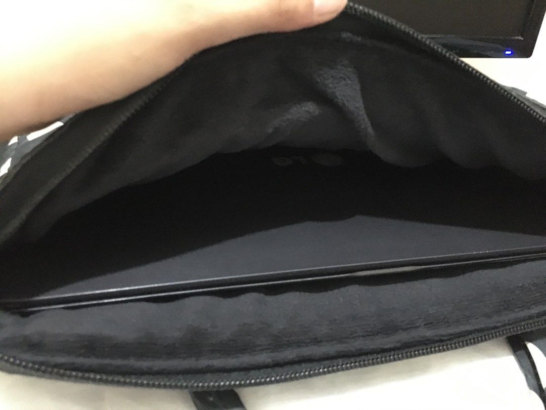 Marc Jacobs Laptop Bag (Category: Luxury Bags & Wallets) located in Pasig City. Submitted by bashadp (Listing ID 1303724210, Image 3). Description: Marc by Marc Jacobs Polka Dot Laptop Bag Carrier 100% nylon. Has a zipper for closure and a small back pocket. 100% Authentic with Authenticity Card Bought from Japan No Sling available Preloved with some wear but not noticeable. Kinda dirty - recommended to have it laundry or bring to bag spa Fleece 