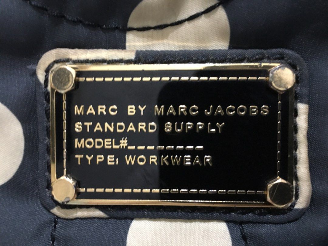 Marc Jacobs Laptop Bag (Category: Luxury Bags & Wallets) located in Pasig City. Submitted by bashadp (Listing ID 1303724210, Image 2). Description: Marc by Marc Jacobs Polka Dot Laptop Bag Carrier 100% nylon. Has a zipper for closure and a small back pocket. 100% Authentic with Authenticity Card Bought from Japan No Sling available Preloved with some wear but not noticeable. Kinda dirty - recommended to have it laundry or bring to bag spa Fleece 