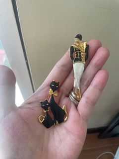 Sold as set- 2 black and gold vintage brooches