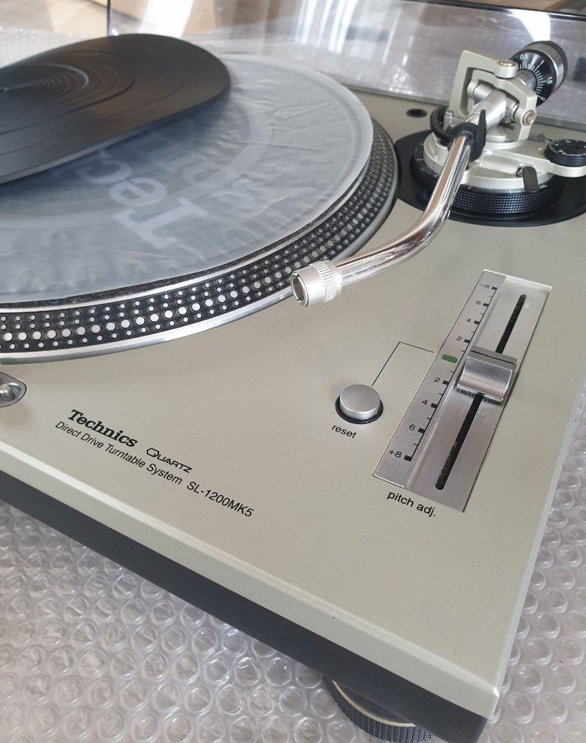 Technics SL-1200MK5 Turntable (Category: Soundbars, Speakers & Amplifiers) located in Manila. Submitted by racz03 (Listing ID 1303754489, Image 3). Description: New Arrival Technics SL-1200MK5 Direct Drive Turntable. Appearance: Mint Condition No Scratches on The Body. Tested, in Excellent Working Condition. It Comes With: Slipmat, Rubber Mat, Plastic mat, 45 rpm Adapter, Dustcover & Auxiliary Weight, With Original High Fedelity Technics Rca Cord