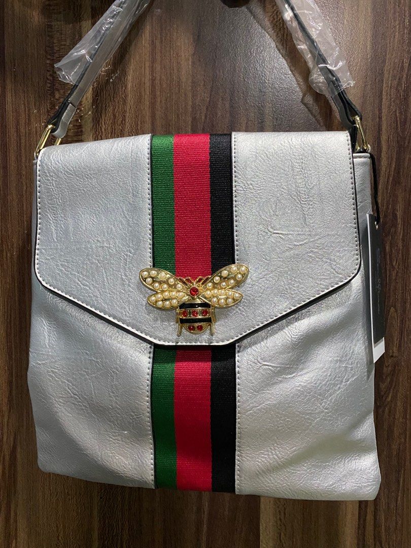 Unisex Silver Sling/shoulder Bag (Category: Cross-body Bags) located in Caloocan City. Submitted by bagsyunlimited (Listing ID 1303600395, Image 3). Description: 📌 Unisex Shoulder/Sling bag 📌 Colors may vary. 📌 Excess items from Bazaar. 📍 South Caloocan .