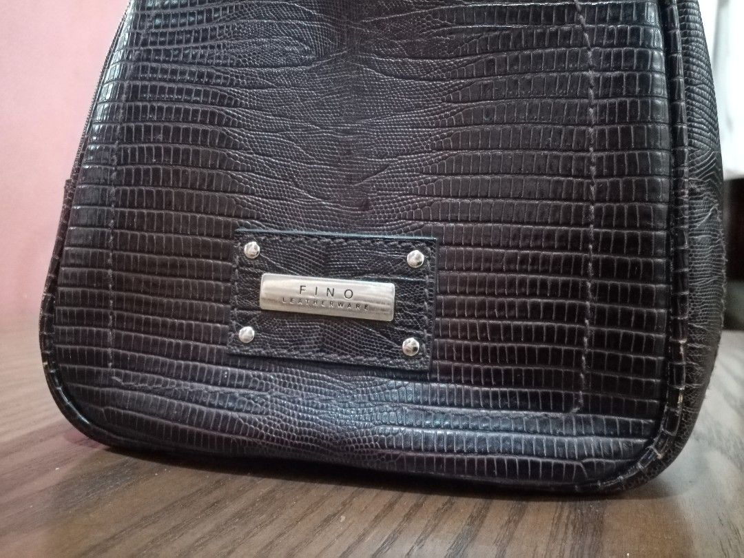 Fino Leatherware Davos Bag (Big) (Category: Tote Bags) located in Cebu City. Submitted by maksipreloveditems (Listing ID 1303911063, Image 3). Description: Fino Leatherware Davos Bag (Big) Color: Dark Brown * * * missing 1 studs (bottom), scuffings * Item is in Cebu City. PLEASE READ: Photos posted are FINAL. NO "When Worn Photos" request please. Flaws were mentioned in the description and shown in the pictures posted. Dimensions: Shoulder: Arms:
