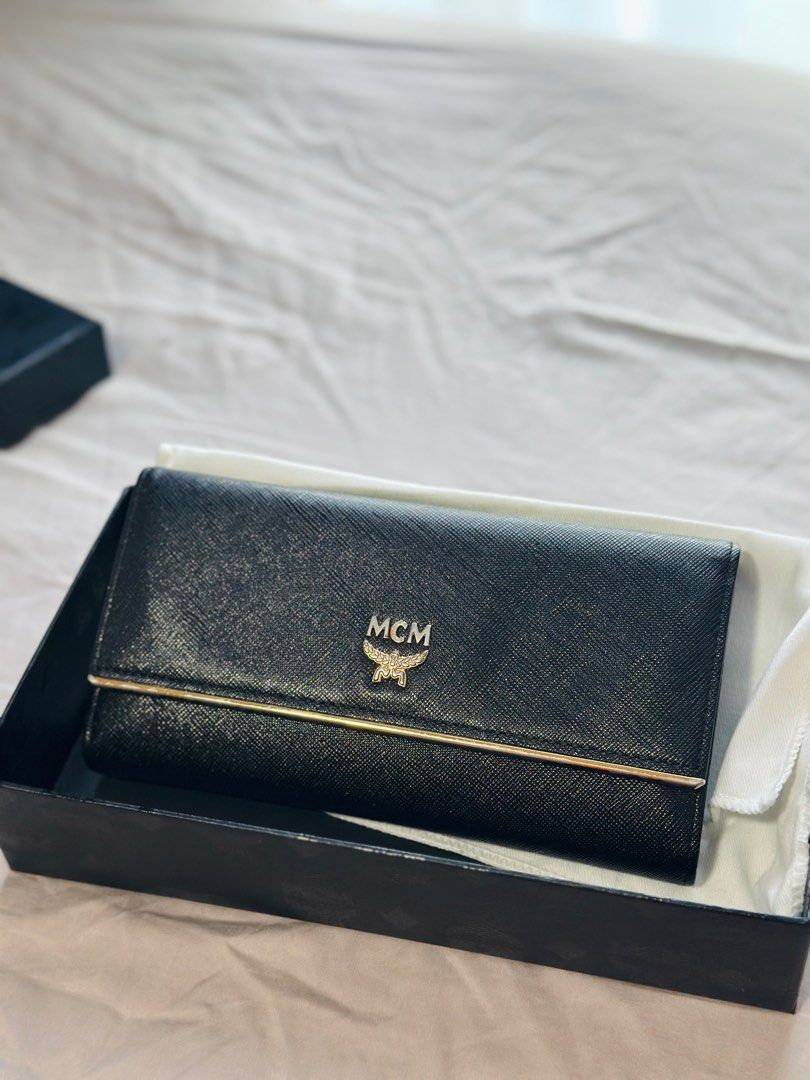 MCM Long Walltet (Category: Bags & Wallets) located in Singapore. Submitted by ct2015 (Listing ID 1303758703, Image 1). Description: MCM women long wallet Lightly used Note: The gold logo and sides have faded as in the picture .