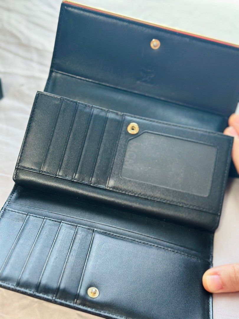MCM Long Walltet (Category: Bags & Wallets) located in Singapore. Submitted by ct2015 (Listing ID 1303758703, Image 3). Description: MCM women long wallet Lightly used Note: The gold logo and sides have faded as in the picture .