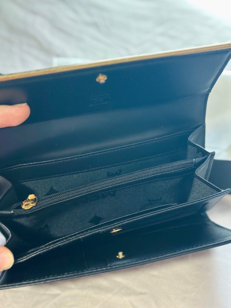 MCM Long Walltet (Category: Bags & Wallets) located in Singapore. Submitted by ct2015 (Listing ID 1303758703, Image 2). Description: MCM women long wallet Lightly used Note: The gold logo and sides have faded as in the picture .