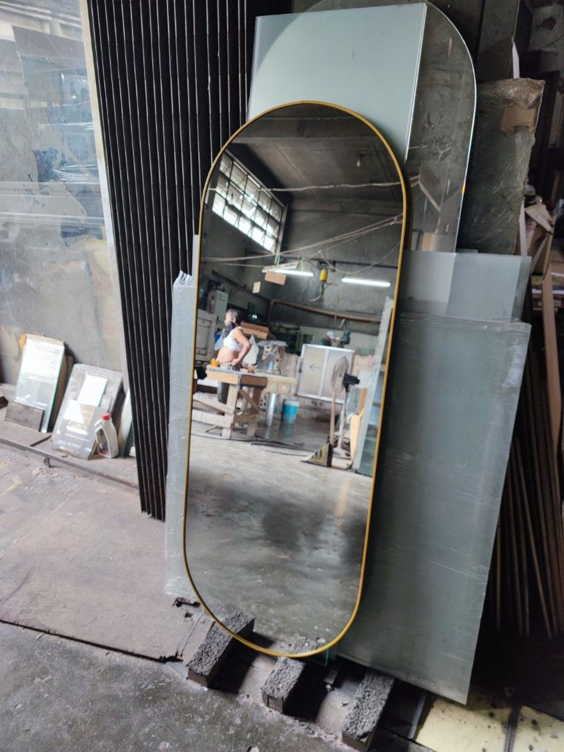 Oval mirror with gold aluminum frame (Category: Mirrors) located in Malabon City. Submitted by mirrors.ph (Listing ID 1303782871, Image 3). Description: Oval mirror with gold aluminum frame and plywood backing using 6mm thick copper free mirror Size: 2ft x 5ft P2700 Add P200 if with back hook.