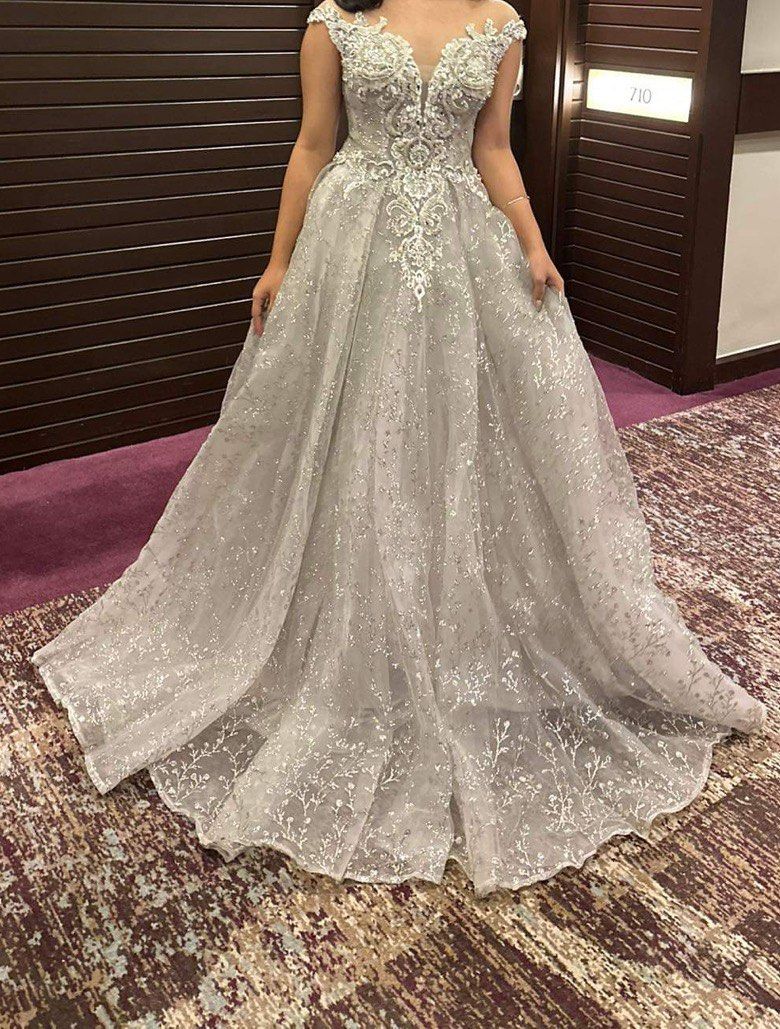 Silver Ball Gown with Petticoat (Category: Evening dresses & gowns) located in Quezon City. Submitted by loveikit (Listing ID 1303833762, Image 1). Description: Fits XS-M Worn once for Prom Good as new ✨ Model is an XS Slightly negotiable.