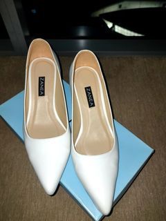 White pointed toe heels