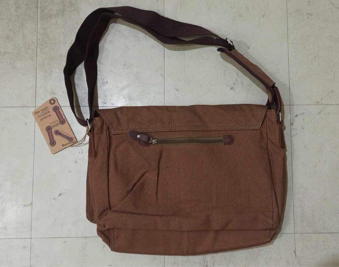 Augur Messenger Sling Bag (Category: Sling Bags) located in Quezon City. Submitted by trishiaa21 (Listing ID 1304075630, Image 3). Description: Brand: Augur >Measurements (L 39 x W 12 x H 30) >Brand New Condition >Material: polyester cotton >Brown Location: Cainta, Rizal.