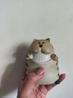 grinning cat figurine