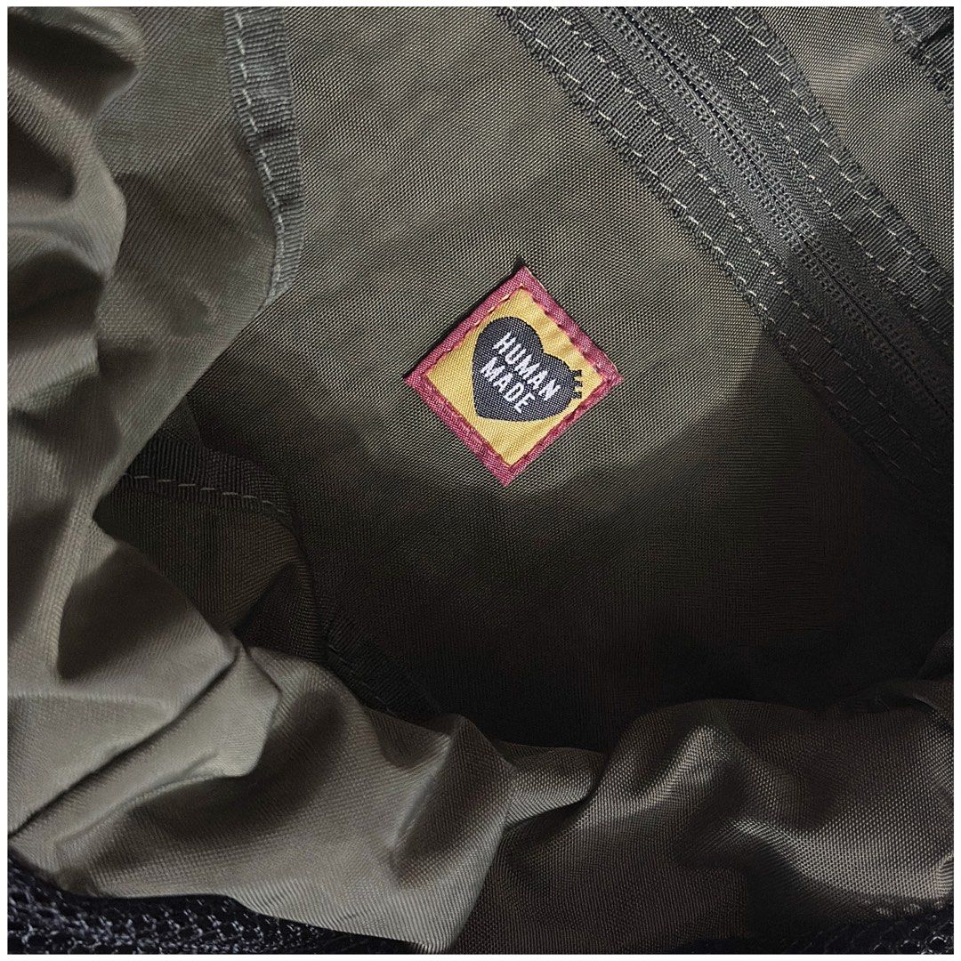 Human Made Drawstring Backpack (Category: Backpacks) located in Kulai. Submitted by hveichai (Listing ID 1304076527, Image 3). Description: Condition : 9.5 / 10 100% Authentic Colorway : Amry Green Sizing : Height: 45cm Width: 43cm Depth: 20cm Handle Length: 7cm Please refer to the pictures for more details. All the pictures is shooting by me and not from online. Please check the pictures and don‘t hesitate to ask any questions about the item ! T