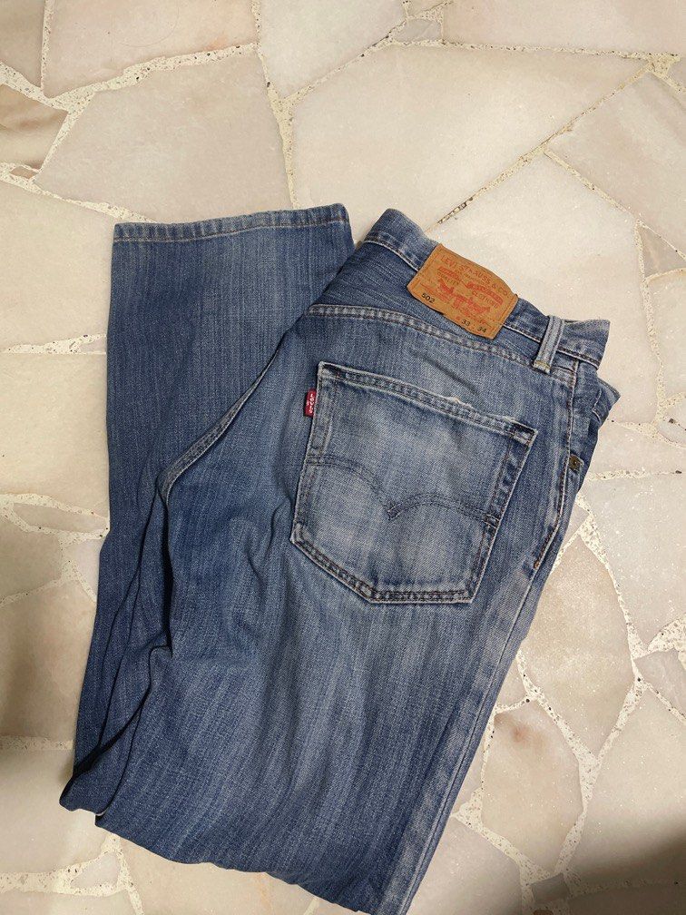 Levis 502 ripped jeans