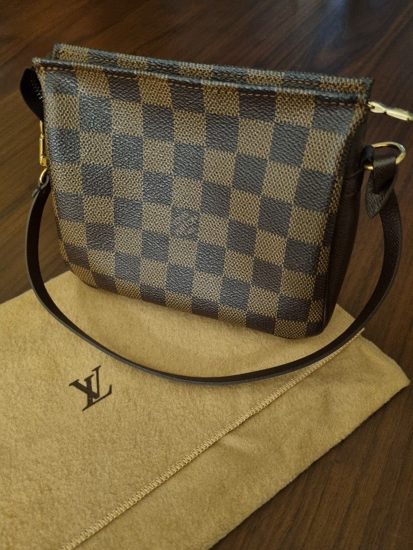 Louis Vuitton Damier Trousse Pochette bag (Category: Luxury Bags & Wallets) located in Taguig. Submitted by chanelgeek (Listing ID 1304001656, Image 1). Description: Authentic Louis Vuitton. Purchased at Greenbelt store. Comes with the Dustbag. Good condition. Size approx 6.5-6.75 inches long, 2-2.25 inches wide, and 5.25-5.5 inches high,.