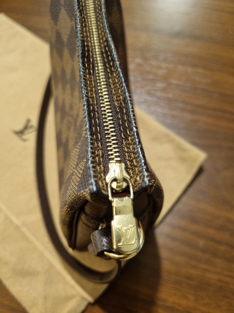 Louis Vuitton Damier Trousse Pochette bag (Category: Luxury Bags & Wallets) located in Taguig. Submitted by chanelgeek (Listing ID 1304001656, Image 3). Description: Authentic Louis Vuitton. Purchased at Greenbelt store. Comes with the Dustbag. Good condition. Size approx 6.5-6.75 inches long, 2-2.25 inches wide, and 5.25-5.5 inches high,.