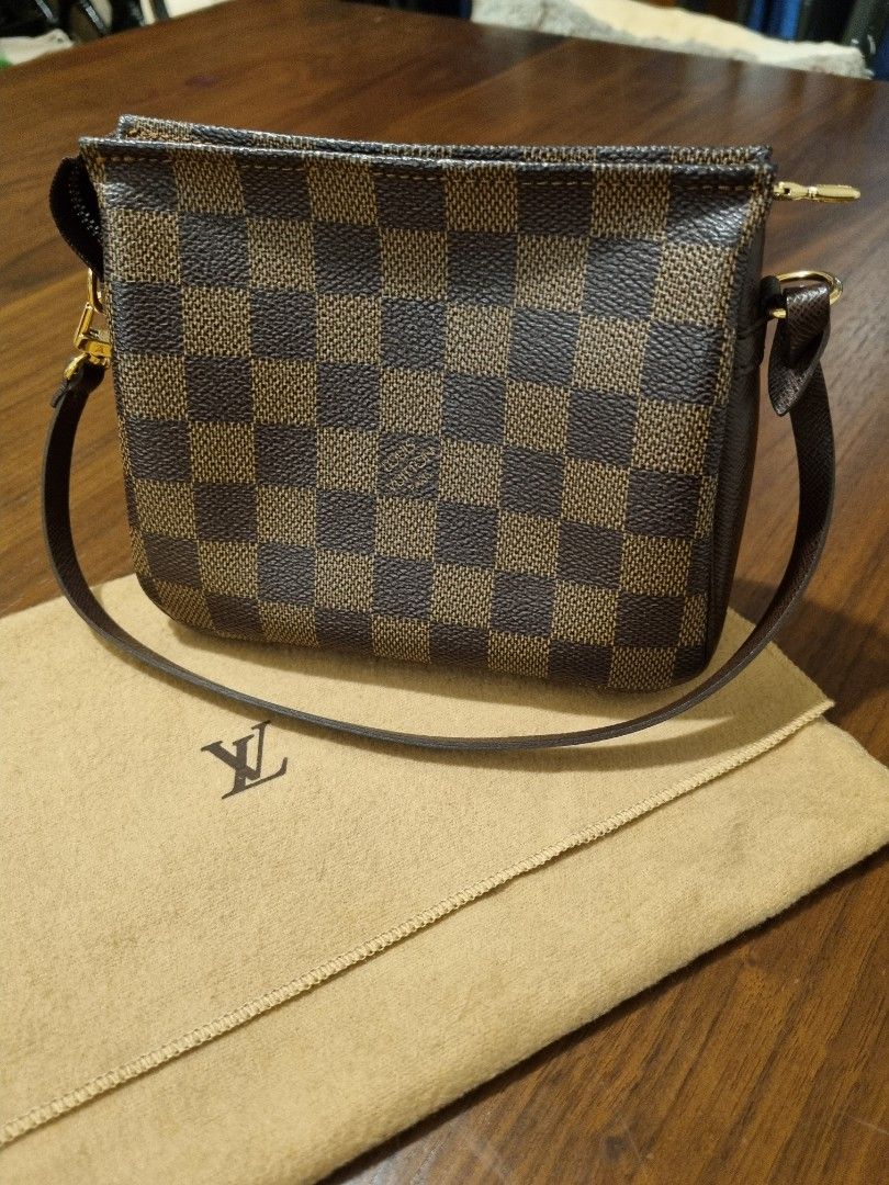 Louis Vuitton Damier Trousse Pochette bag (Category: Luxury Bags & Wallets) located in Taguig. Submitted by chanelgeek (Listing ID 1304001656, Image 2). Description: Authentic Louis Vuitton. Purchased at Greenbelt store. Comes with the Dustbag. Good condition. Size approx 6.5-6.75 inches long, 2-2.25 inches wide, and 5.25-5.5 inches high,.