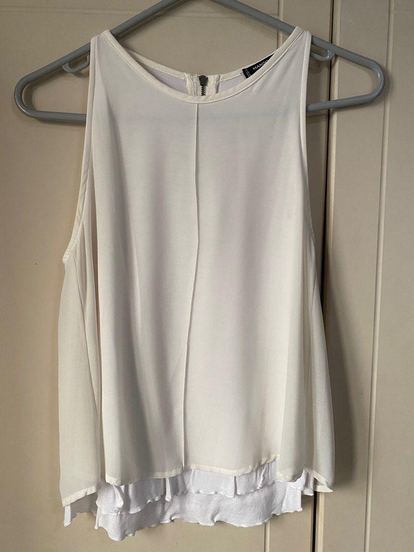 Mango Sleeveless (Category: Sleeveless) located in Quezon City. Submitted by inxshop (Listing ID 1304010801, Image 1). Description: Check close-up photo for tag details. RFS: decluttering Fits XS to S frames Pick-up/Rider fee c/o Buyer.