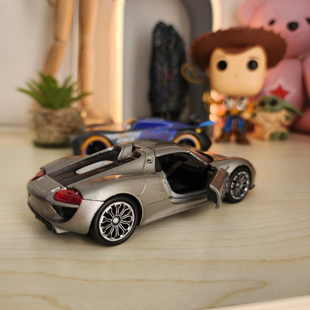 1. Disney Pixar Cars Neon Lights Jackson Storm 1/43 2. Welly Porche