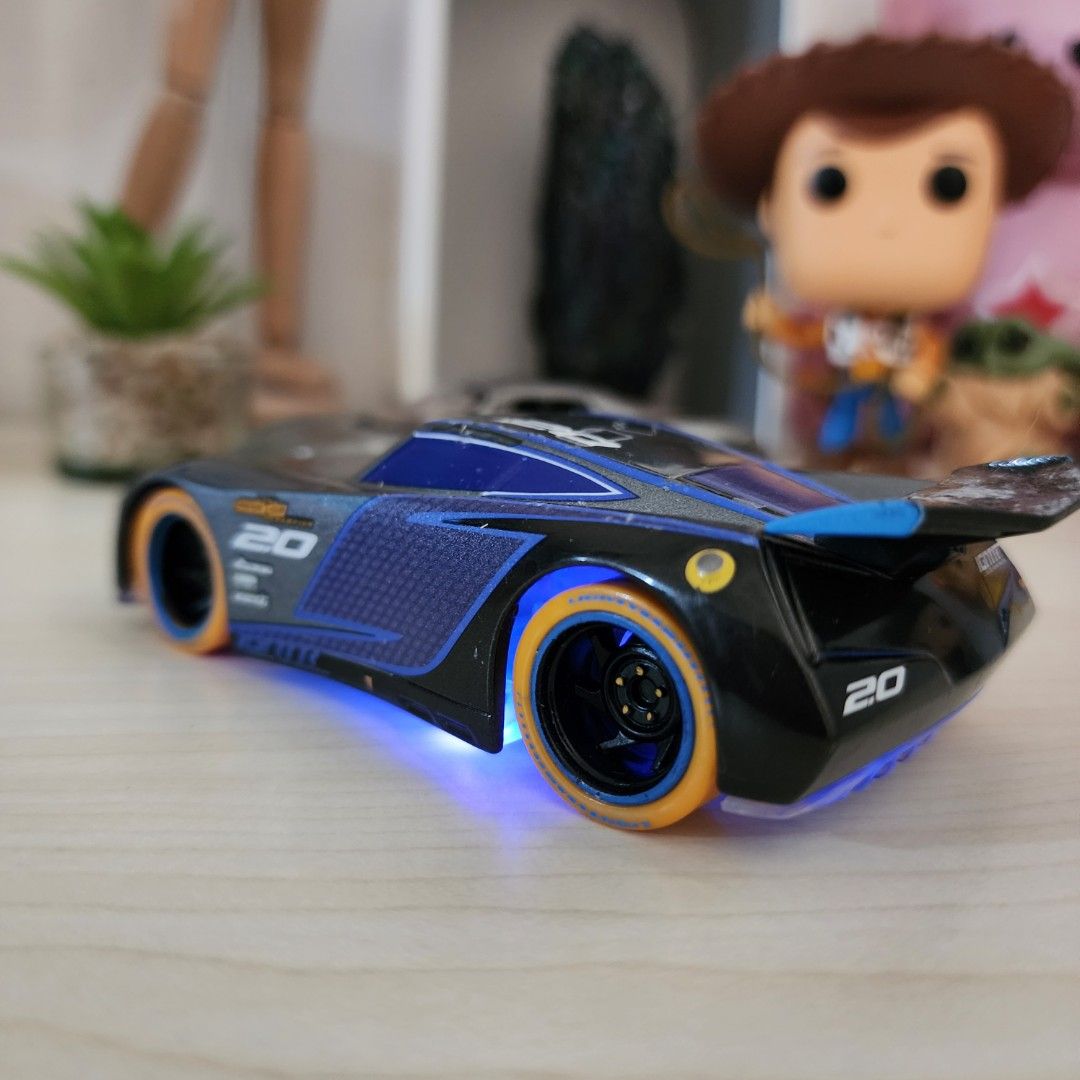 1. Disney Pixar Cars Neon Lights Jackson Storm 1/43 2. Welly Porche
