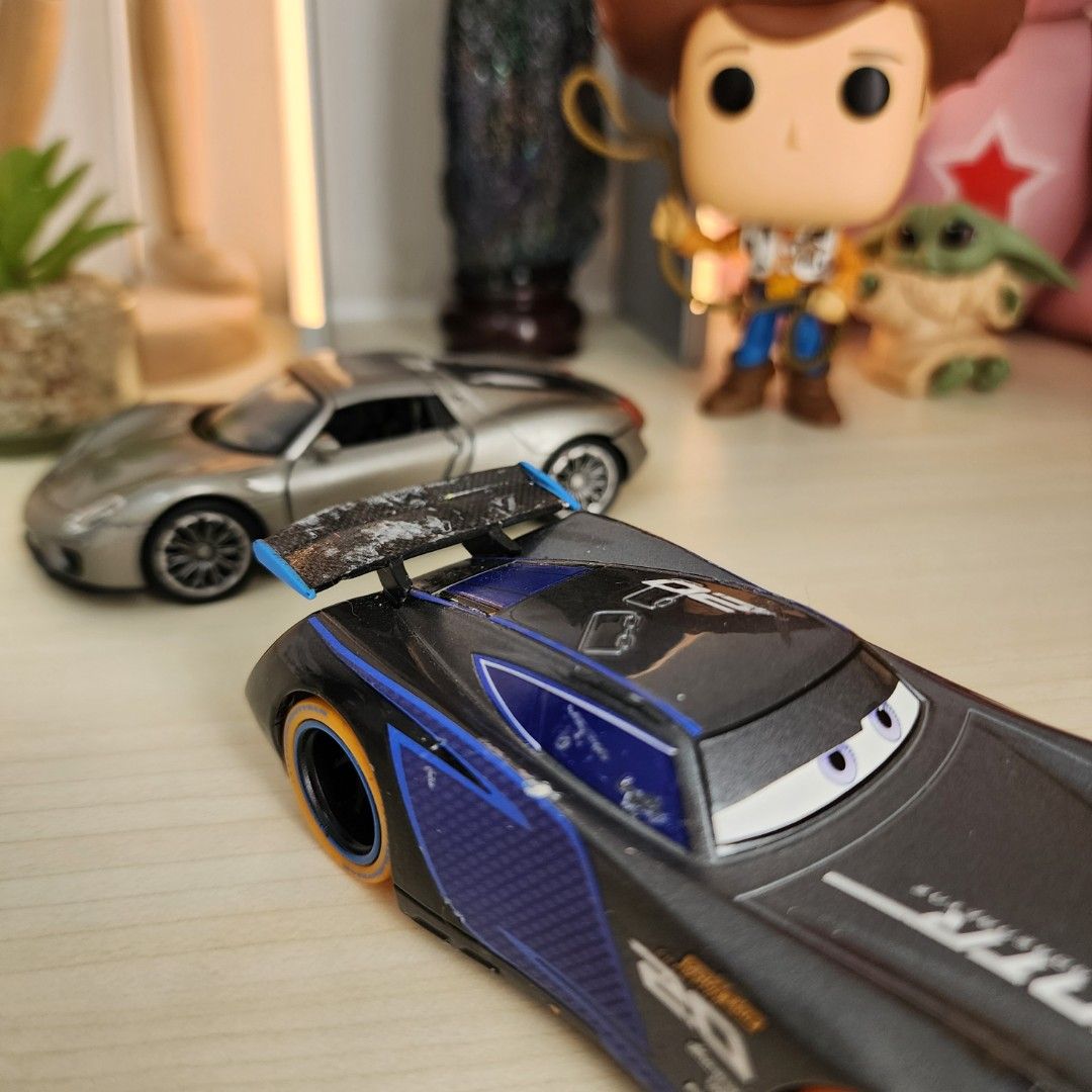 1. Disney Pixar Cars Neon Lights Jackson Storm 1/43 2. Welly Porche