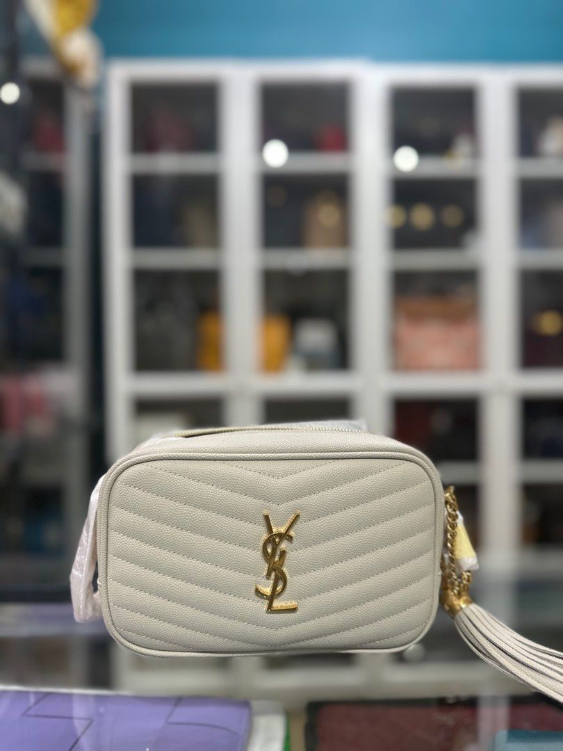 YSL Mini Lou Camera Chain Bag White in Gold Hardware (Category: Luxury Bags & Wallets) located in Taguig. Submitted by closetcompany (Listing ID 1301203707, Image 1). Description: YSL Mini Lou Camera Chain Bag White in Gold Hardware 🫧Php 75,000 🫧CONDITION: Brand new 🫧INCLUSIONS: dust bag, box, paper bag, and care cards and entrupy 🫧Modes of Payment: Cash BDO credit card (Up to 12 mos installment with interest) Layaway Paypal Accepted Bank Tra