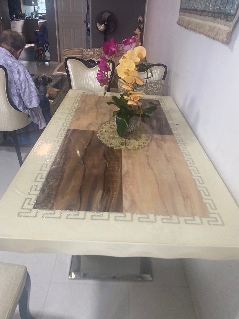 Dining Table (Category: Tables & Sets) located in Singapore. Submitted by zaad786 (Listing ID 1304320774, Image 3). Description: Ceramic dining table Ofwhite Col with 6 chairs still good condition ard 75%, used occasionally , slight dents on the edge and chairs also , need to shift house otherwise wouldn’t be required to sell..