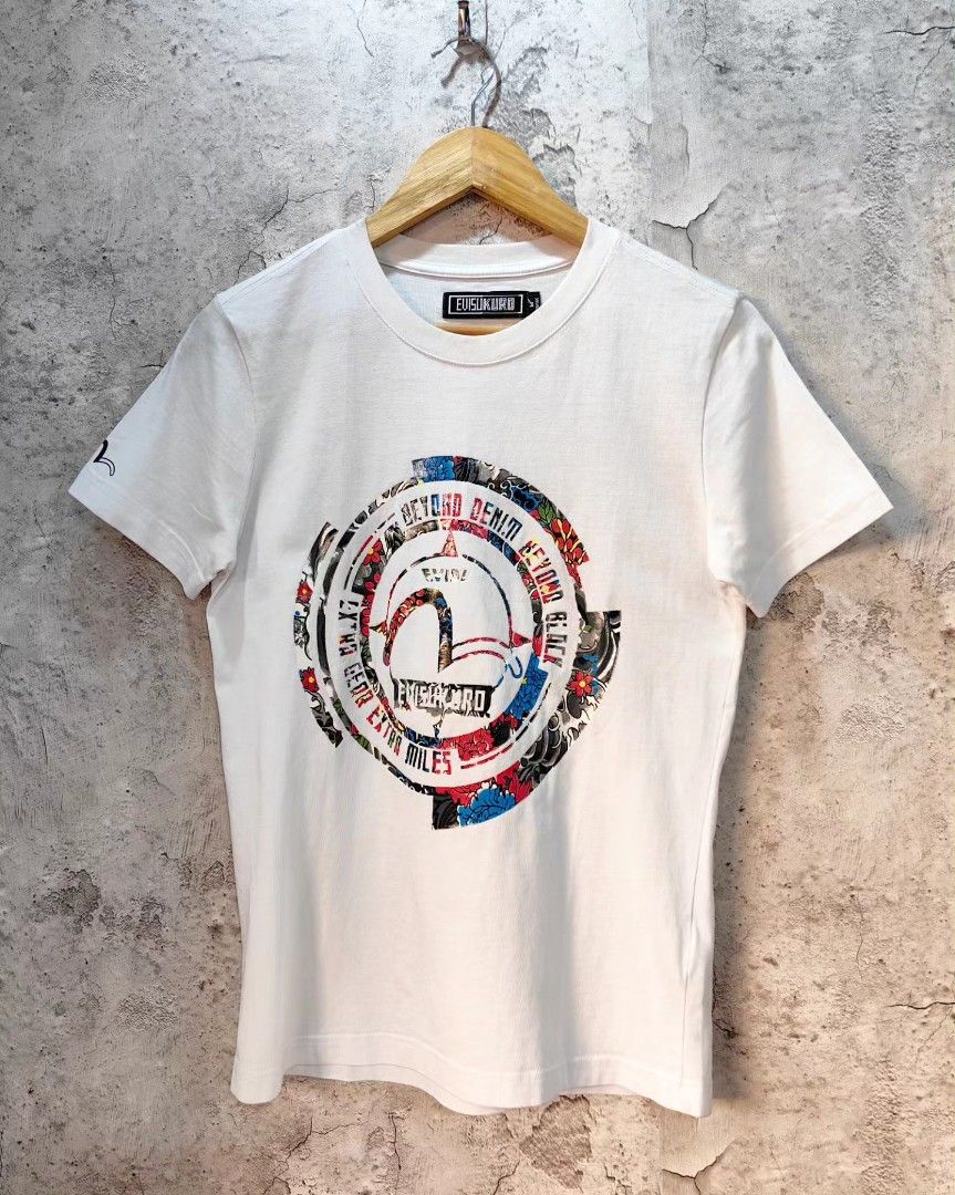 Evisukuro T-shirt (Category: Luxury Apparel) located in Quezon City. Submitted by 110collectionsph (Listing ID 1304374926, Image 1). Description: EVISUKURO T-SHIRT | P498 | MEDIUM | WHITE | L25.5xW17.5 | PRISTINE CONDITION NO ISSUE (needs wash) | 9.9/10 COLOR RATE AND CONDITION COMMENT MINE OR DM US. AVAILABLE ONLINE AND IN-STORE! Disclaimer: product color may vary due to photographic lighting sources, post-processing editing or your monitor sett