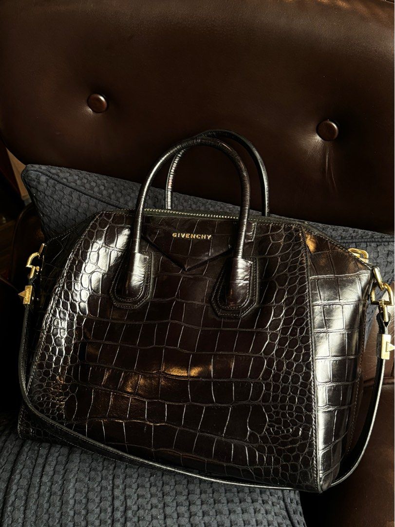 Givenchy Antigona Crocodile Medium (Category: Luxury Bags & Wallets) located in Quezon City. Submitted by secondninico (Listing ID 1304420595, Image 1). Description: GIVENCHY Antigona Bag Black Croc Embossed Leather Medium Gunmetal Hardware MADE IN ITALY 100% Calfskin Elevate your style with the luxurious Givenchy Antigona Medium Bag in crocodile stamped calf leather. Renowned for its structured silhouette and timeless elegance, this statement pi