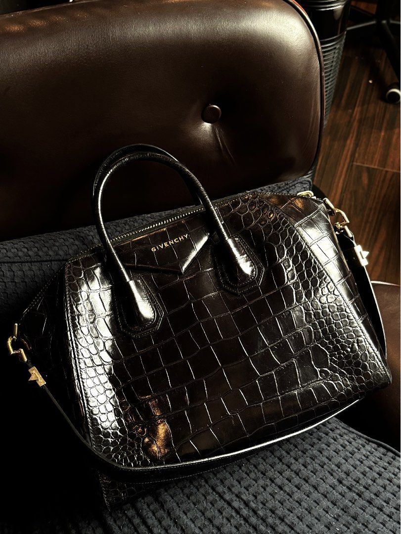 Givenchy Antigona Crocodile Medium (Category: Luxury Bags & Wallets) located in Quezon City. Submitted by secondninico (Listing ID 1304420595, Image 2). Description: GIVENCHY Antigona Bag Black Croc Embossed Leather Medium Gunmetal Hardware MADE IN ITALY 100% Calfskin Elevate your style with the luxurious Givenchy Antigona Medium Bag in crocodile stamped calf leather. Renowned for its structured silhouette and timeless elegance, this statement pi