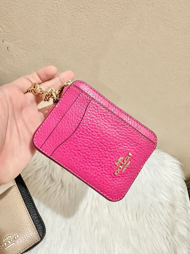 Original Coach Zip Card Case in Bold Pink (Category: Luxury Bags & Wallets) located in Las Pinas. Submitted by anasonlineshophtplaspinas (Listing ID 1304397201, Image 1). Description: Original Coach Zip Card Case in Bold Pink Refined pebble leather| Two credit card slots| ID window| Open pockets| Zip compartment| Chain wrist strap with dogleash clip attached| 3” (L) x 4 1/4” (H) x 3/4” (W).