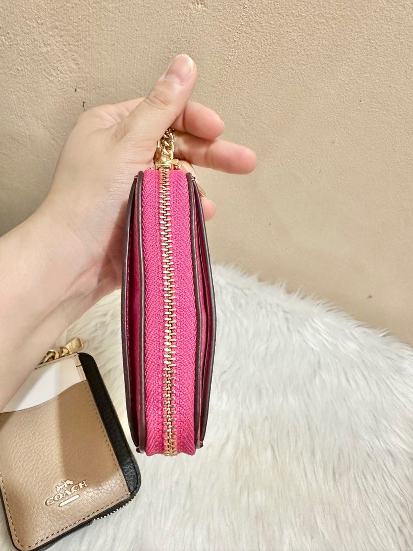 Original Coach Zip Card Case in Bold Pink (Category: Luxury Bags & Wallets) located in Las Pinas. Submitted by anasonlineshophtplaspinas (Listing ID 1304397201, Image 2). Description: Original Coach Zip Card Case in Bold Pink Refined pebble leather| Two credit card slots| ID window| Open pockets| Zip compartment| Chain wrist strap with dogleash clip attached| 3” (L) x 4 1/4” (H) x 3/4” (W).