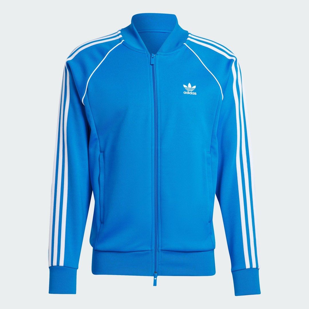 Adidas Jacket (Category: Coats, Jackets and Outerwear) located in Singapore. Submitted by geri7 (Listing ID 1304456549, Image 3). Description: ORIGINAL ADICOLOR CLASSICS SST TRACK JACKET Size: L Condition: Good as new, only wore once RFS: Size is a but big for me, hence selling Slim fit Full zip with ribbed stand up collar 70% polyester (recycled), 30% cotton Zip pockets Ribbed hem and cuffs Colour: Blue Bird / White.
