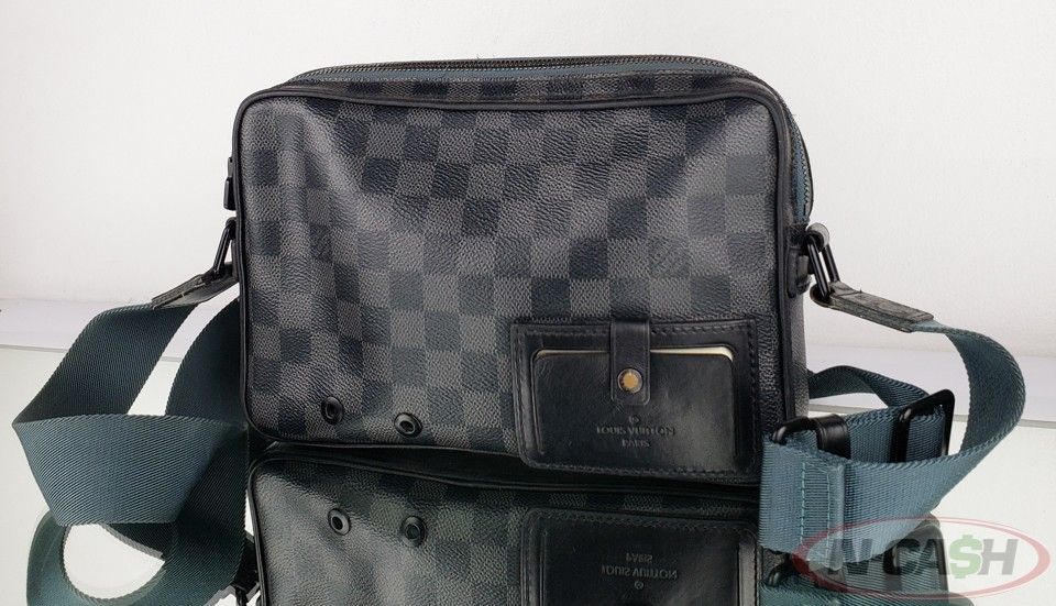 Authentic LOUIS VUITTON Alpha Damier Graphite Messenger Bag (Category: Luxury Bags & Wallets) located in Quezon City. Submitted by luxury_by_n-cash (Listing ID 1304470851, Image 3). Description: N-Cash Pawnshop "Instant Cash for Bags, Watches, Cars, and Electronics" https://www.ncash-pawnshop-philippines.com/ LOUIS VUITTON ALPHA DAMIER GRAPHITE CANVAS MESSENGER BAG PRE-OWNED Measures: 10.25" L x 6.75" H x 2" D (approx) 12"-21" Strap Drop, adjusta