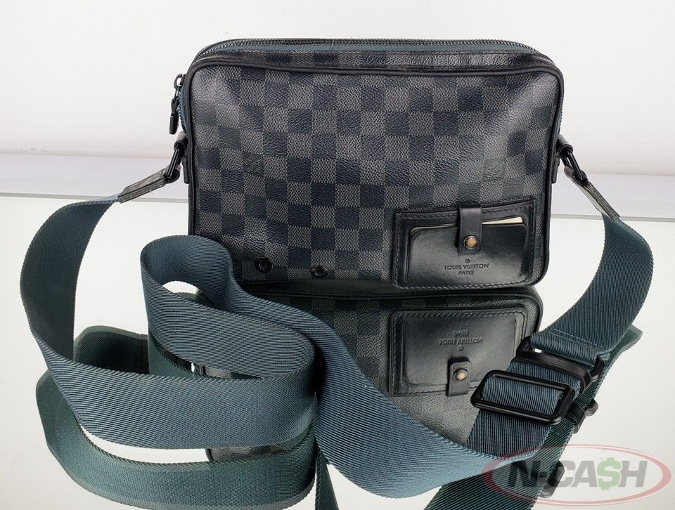 Authentic LOUIS VUITTON Alpha Damier Graphite Messenger Bag (Category: Luxury Bags & Wallets) located in Quezon City. Submitted by luxury_by_n-cash (Listing ID 1304470851, Image 2). Description: N-Cash Pawnshop "Instant Cash for Bags, Watches, Cars, and Electronics" https://www.ncash-pawnshop-philippines.com/ LOUIS VUITTON ALPHA DAMIER GRAPHITE CANVAS MESSENGER BAG PRE-OWNED Measures: 10.25" L x 6.75" H x 2" D (approx) 12"-21" Strap Drop, adjusta
