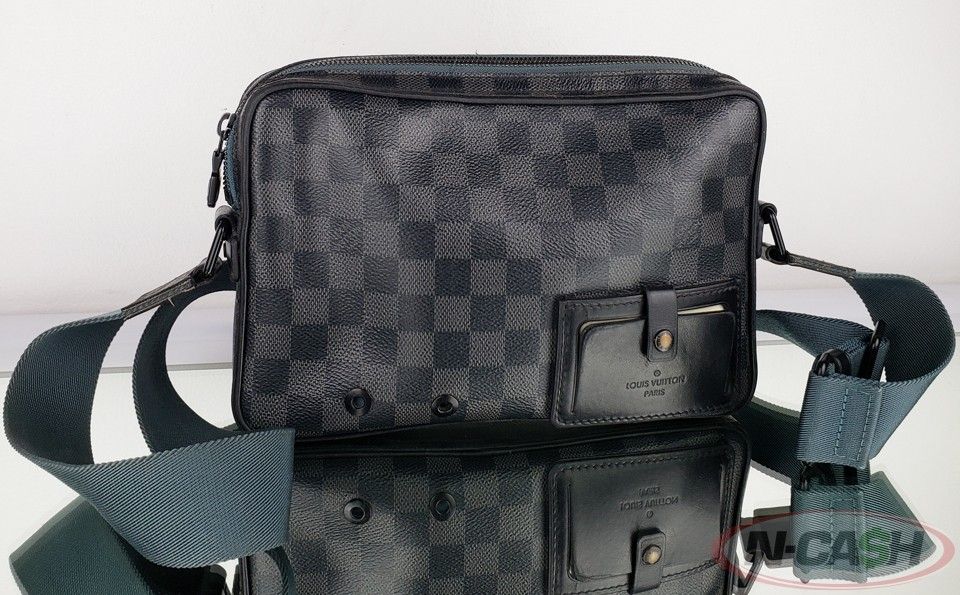 Authentic LOUIS VUITTON Alpha Damier Graphite Messenger Bag (Category: Luxury Bags & Wallets) located in Quezon City. Submitted by luxury_by_n-cash (Listing ID 1304470851, Image 1). Description: N-Cash Pawnshop "Instant Cash for Bags, Watches, Cars, and Electronics" https://www.ncash-pawnshop-philippines.com/ LOUIS VUITTON ALPHA DAMIER GRAPHITE CANVAS MESSENGER BAG PRE-OWNED Measures: 10.25" L x 6.75" H x 2" D (approx) 12"-21" Strap Drop, adjusta