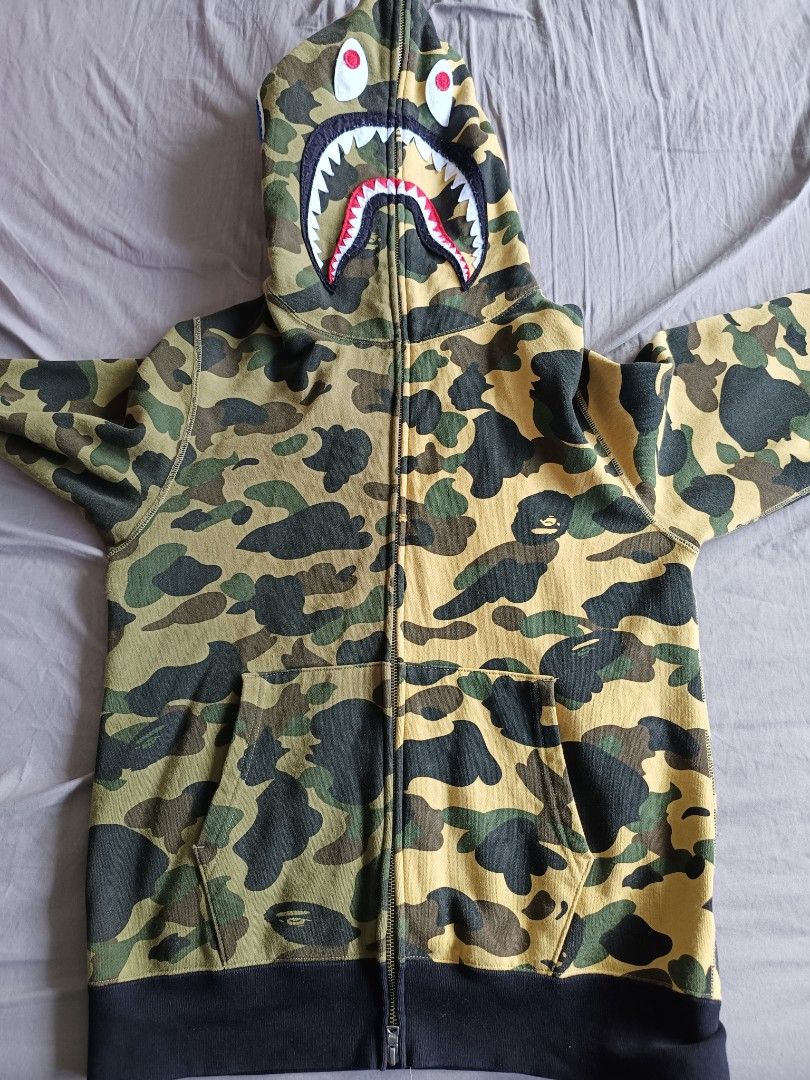 Bape Jacket (Category: Coats, Jackets and Outerwear) located in Singapore. Submitted by chen.yyy (Listing ID 1304480513, Image 1). Description: letting go my pre loved 😭 It's been awhile in my closet because I gained fat now too tight for me *refer to last pic for the only flaw negotiable for fast deal , free to chat with me.