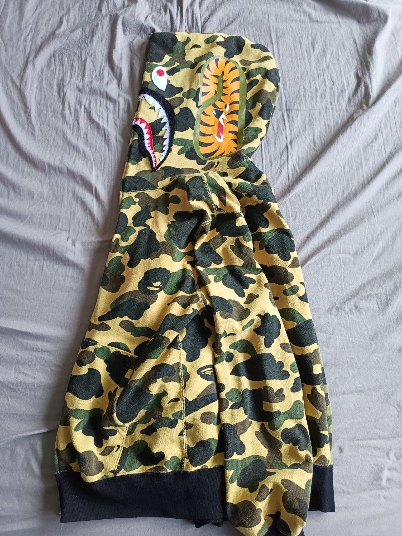 Bape Jacket (Category: Coats, Jackets and Outerwear) located in Singapore. Submitted by chen.yyy (Listing ID 1304480513, Image 2). Description: letting go my pre loved 😭 It's been awhile in my closet because I gained fat now too tight for me *refer to last pic for the only flaw negotiable for fast deal , free to chat with me.