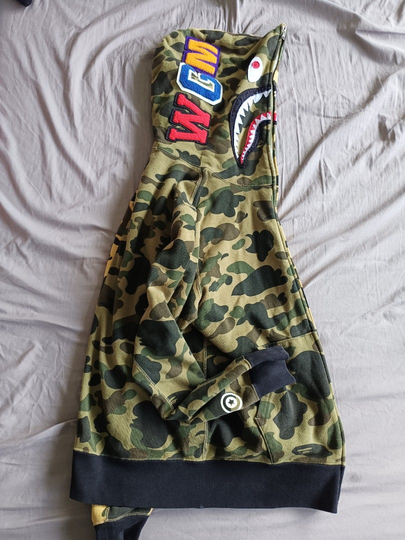 Bape Jacket (Category: Coats, Jackets and Outerwear) located in Singapore. Submitted by chen.yyy (Listing ID 1304480513, Image 3). Description: letting go my pre loved 😭 It's been awhile in my closet because I gained fat now too tight for me *refer to last pic for the only flaw negotiable for fast deal , free to chat with me.
