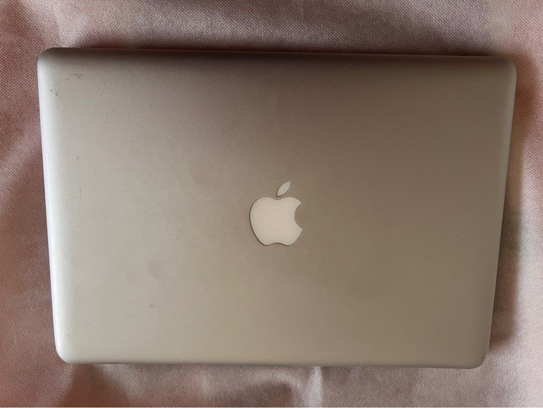 MacBook Pro 13-inch, Mid-2012 (New battery, new SSD) (Category: Laptops & Notebooks) located in Paranaque City. Submitted by fromandie (Listing ID 1304499501, Image 2). Description: Apple MacBook Pro mid-2012 13-inch display - Brand new battery since Jan 2024 - Brand new storage since Jan 2024 (256Gb SSD) Display: 13.3-inch LED Processor: 2.5GHz Intel Core i5 Memory: 4GB RAM Storage: 256Gb SSD Condition: heavily used, with dents and scratches but