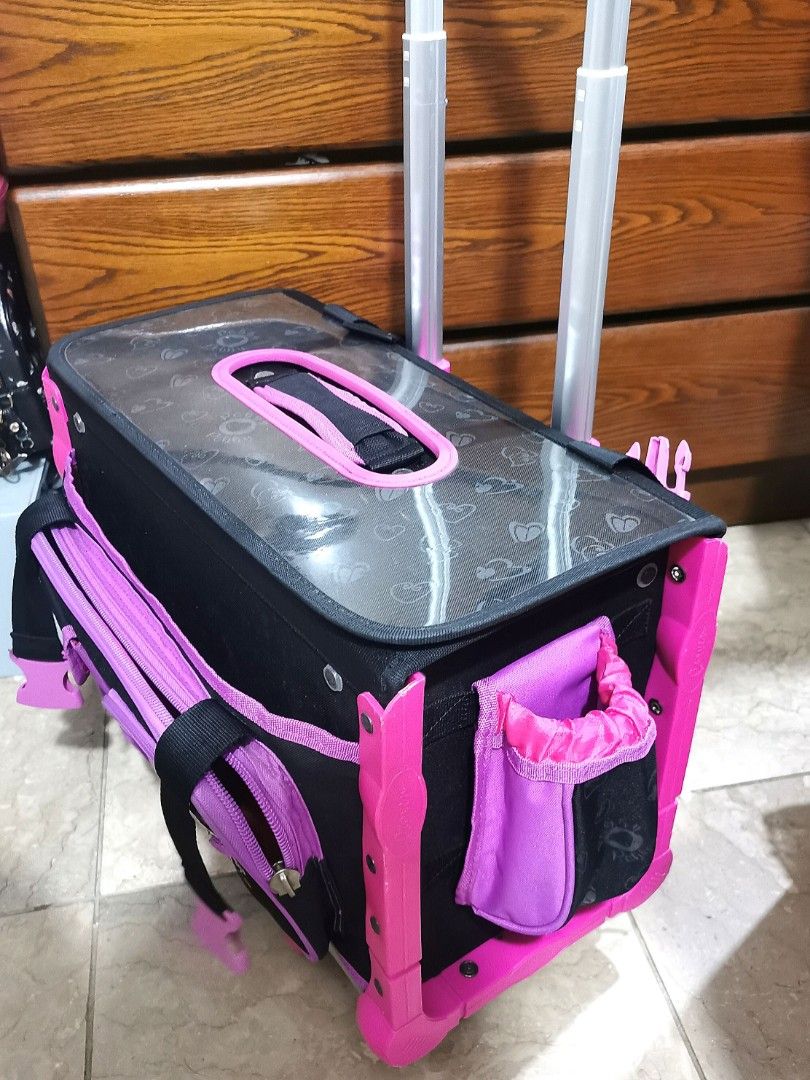 Robby Rabbit Pink, Purple, Black Stroller Bag (Category: Strollers) located in Bacoor. Submitted by ctrl_thrift_ (Listing ID 1304547219, Image 3). Description: Pre-loved Kids Stroller for Girls Color: Black, pink, and purple mix Location: BR1 Details: Includes lunch bag, side bag pocket, rain cover, water bottle, juicer holder Trolley handle with push-button Bottom pull-out front support for better balance & heavy loads Wheels tilt back for extra