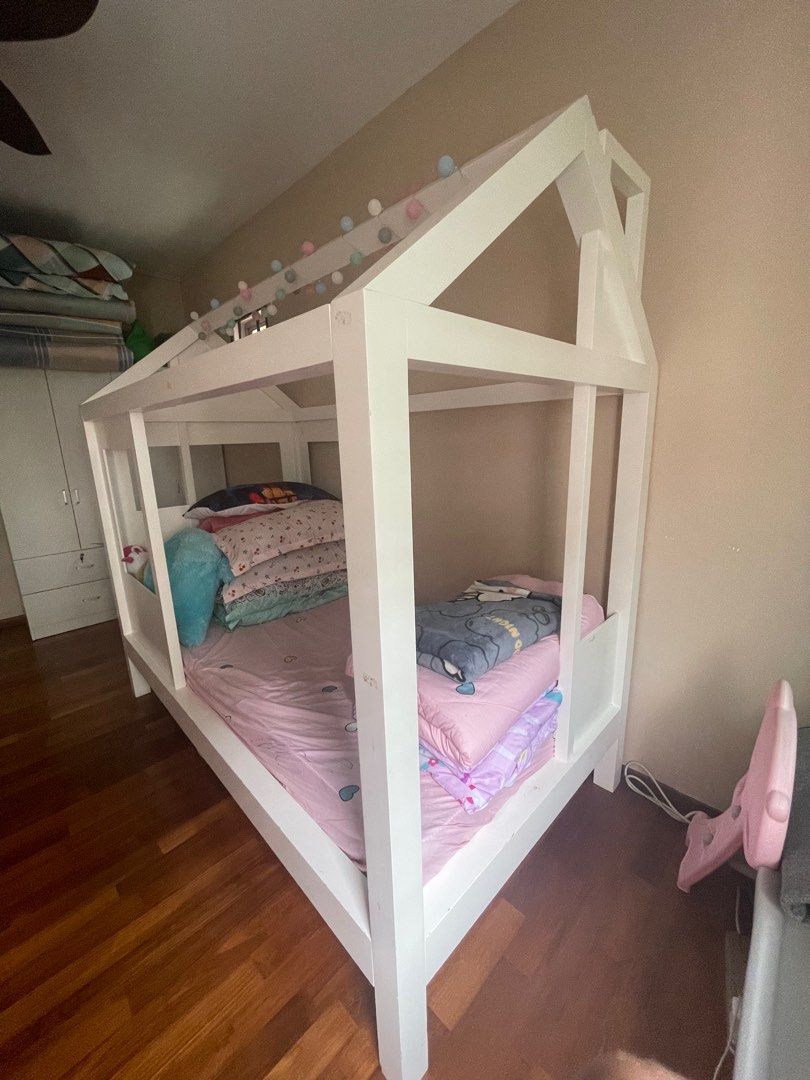 Tiny House Single Bed (Category: Childrens' Beds) located in Singapore. Submitted by shopthisway (Listing ID 1304513461, Image 1). Description: *NOT FOR FUSSY* Bought this for almost $2k from Crate and Barrel. My girl rarely sleeps here as she is still sleeping with us. It's a beautiful piece however this is very very heavy hence need to disassemble. Need more than 1 person to do this. Please swipe to see dents caused by her toys hence not for fu