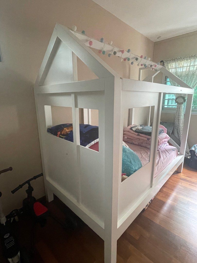 Tiny House Single Bed (Category: Childrens' Beds) located in Singapore. Submitted by shopthisway (Listing ID 1304513461, Image 3). Description: *NOT FOR FUSSY* Bought this for almost $2k from Crate and Barrel. My girl rarely sleeps here as she is still sleeping with us. It's a beautiful piece however this is very very heavy hence need to disassemble. Need more than 1 person to do this. Please swipe to see dents caused by her toys hence not for fu