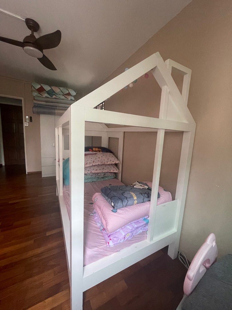 Tiny House Single Bed (Category: Childrens' Beds) located in Singapore. Submitted by shopthisway (Listing ID 1304513461, Image 2). Description: *NOT FOR FUSSY* Bought this for almost $2k from Crate and Barrel. My girl rarely sleeps here as she is still sleeping with us. It's a beautiful piece however this is very very heavy hence need to disassemble. Need more than 1 person to do this. Please swipe to see dents caused by her toys hence not for fu