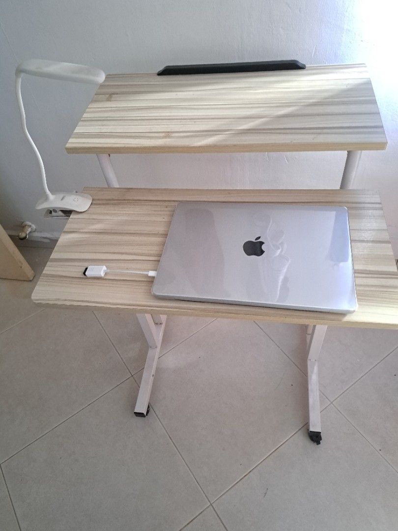 Height adjustable computer table (Category: Tables & Sets) located in Singapore. Submitted by namitha85 (Listing ID 1304668770, Image 2). Description: very comfortable computer table. Height of the table ( both the monitor section as well as key board section) can be adjusted according to our requirement. Selling it off as we are relocating.